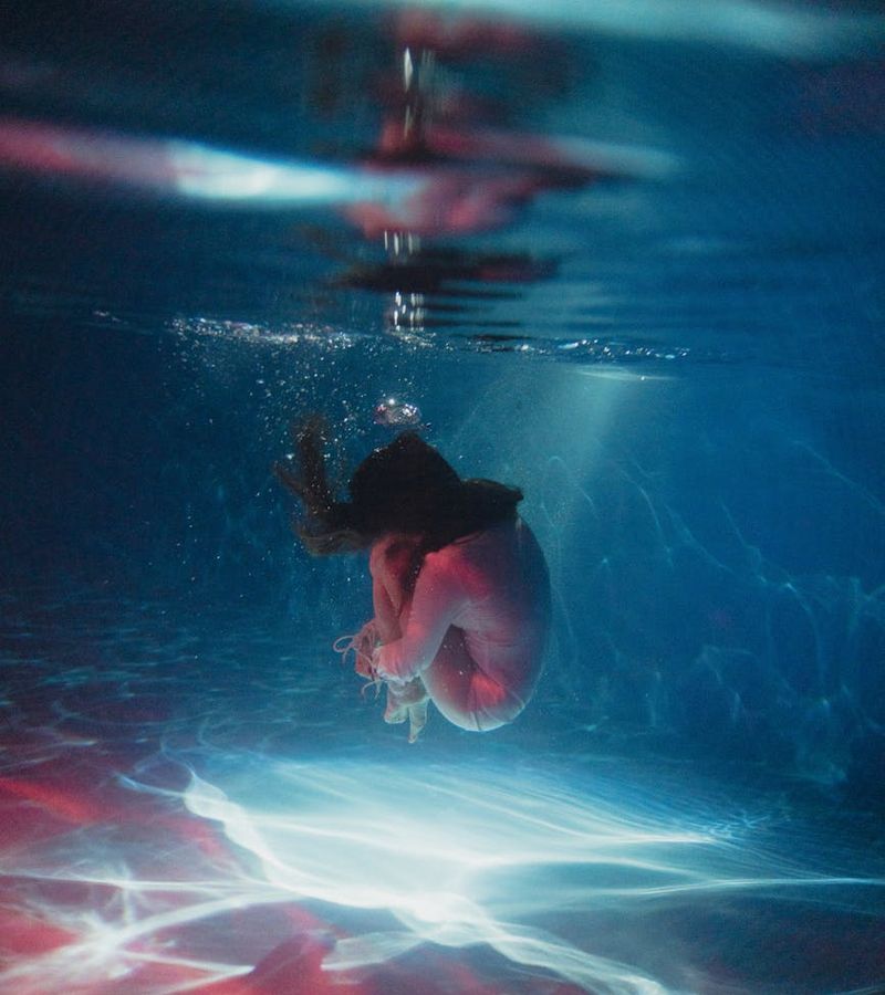 Woman in a dynamic yet graceful pose, suggesting fluid movement.